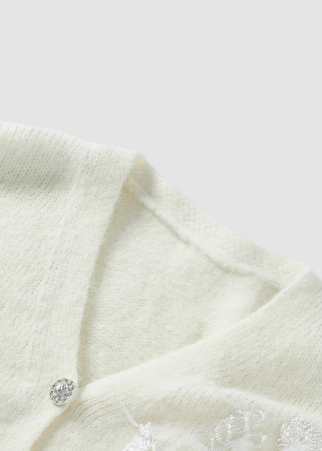 Cardigan à col en V avec accent floral délicat