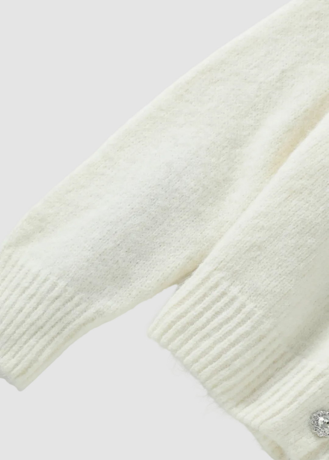 Cardigan à col en V avec accent floral délicat