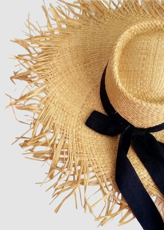 Chapeau de soleil en paille de raphia à franges avec nœud en ruban noir